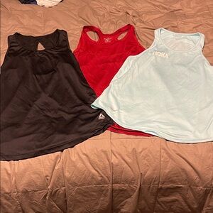 Women's Black, Red, and Light Blue Tank Tops. Includes hoka, brooks and Reebok